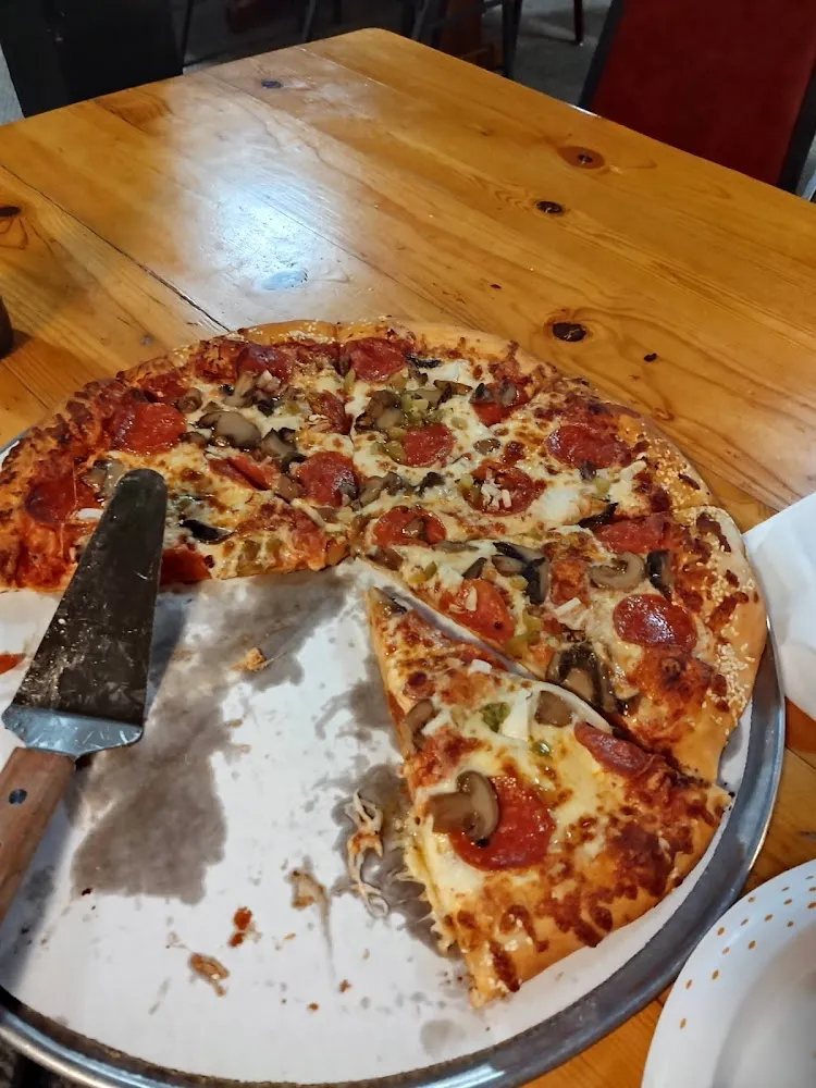 Pepperoni Green Pepper Onion and Mushroom Pizza